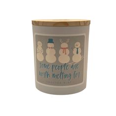 a candle with some snowmen on it and the words home people are worthin't melting for