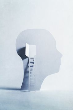 the silhouette of a person's head with a ladder sticking out of its side