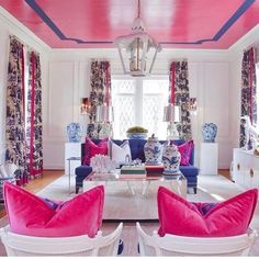 the living room is decorated in pink and blue