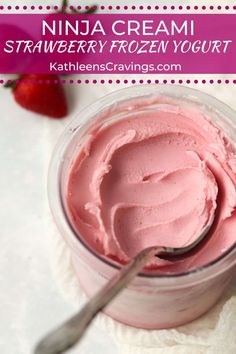 a bowl of strawberry frozen yogurt with a spoon in it