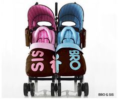 two baby strollers sitting side by side