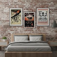 a bedroom with brick walls and posters on the wall above the bed, along with two nightstands