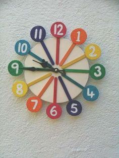 a colorful clock with numbers on the face