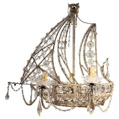 an antique chandelier with many crystal beads and chains hanging from it's sides