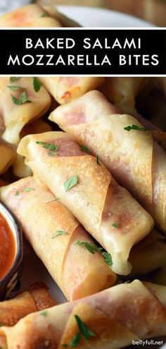 baked salami mozzarella bites on a plate with dipping sauce