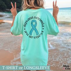 Our Awareness Ribbon Comfort Colors® short sleeve or long sleeve shirt, designed to spread awareness for those with dysautonomia. Show your support and spark conversations about chronic illnesses like POTS, Ehlers Danlos EDS, vasovagal syncope, and the challenges of living with an invisible illness. The soft-washed, garment-dyed shirt has a relaxed fit - perfect or the oversized look. 📦 𝐇𝐎𝐖 𝐓𝐎 𝐎𝐑𝐃𝐄𝐑: ------------------------------------------------------------------ 1️⃣ Select product Dysautonomia Awareness, Ehlers Danlos, Awareness Ribbon, Invisible Illness, Awareness Shirt, Silhouette Crafts, Awareness Ribbons, Color Shorts, Comfort Colors