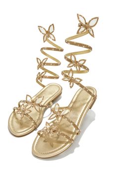 Step into the Fantasy sandals, made for special occasions. The sleek gold tone design is accented by butterfly patches embellished around the ankle coil. The sandals have a lightly padded interior for an extra comfortable fit. Look your best with this stylish sandal. Stock Unit: 27A1 SIZE & FIT Shoe Model Suggestio Gold Flat Heel Sandals For Spring, Gold Embellished Ankle Strap Sandals, Gold Embellished Flat Sandals, Glamorous Gold Flat Sandals, Gold Embellished Round Toe Sandals, Gold Embellished Sandals With Round Toe, Gold Outfit Aesthetic, Bridesmaid Sandals, Prom Gold