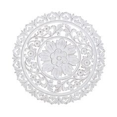 a white paper cutout with an intricate design on the center and bottom part of it