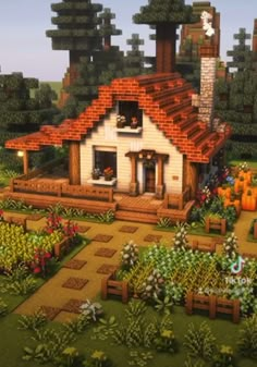 an image of a house in the middle of a garden with pumpkins around it