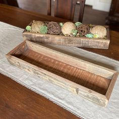 two wooden boxes sitting on top of a table