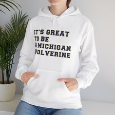 Celebrate the pride and tradition of the University of Michigan with our "It's Great To Be A Michigan Wolverine" sweatshirt. Featuring this iconic chant emblazoned in bold lettering across the chest, this sweatshirt embodies the spirit of camaraderie and excellence that defines the Wolverine community. Crafted from cozy, high-quality material, it offers warmth and comfort during chilly game days or casual outings. Whether you're cheering at the Big House, attending alumni events, or simply showc Michigan Hoodie, Alumni Events, Maize And Blue, The Wolverine, Bold Lettering, Big House, Go Blue, University Of Michigan, Michigan Wolverines