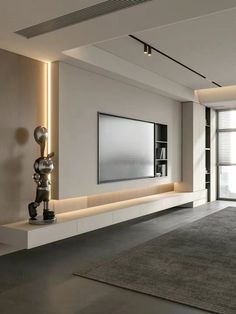 a modern living room with white walls and grey carpeting on the floor is lit by recessed lighting