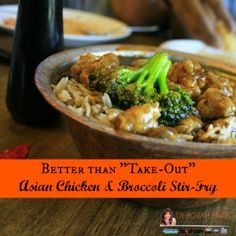 a wooden bowl filled with rice and broccoli