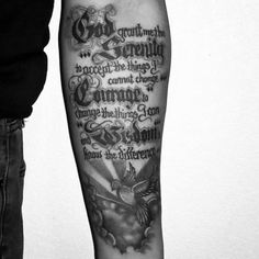 a man with a black and white tattoo on his arm that has words written in different languages