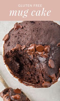 a chocolate cake is cut in half on a white plate with the words gluten free mug cake above it