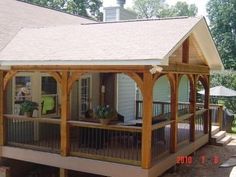 a small wooden porch with a covered patio