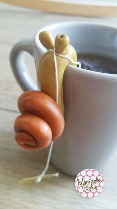 a hot dog in a mug is tied to the side