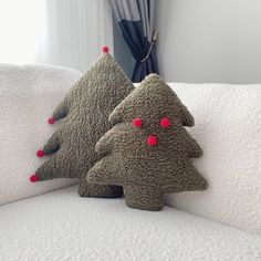 two pillows that have been made to look like christmas trees