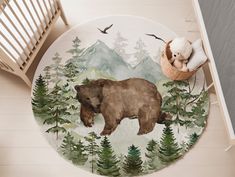 a bear rug with trees and birds on it