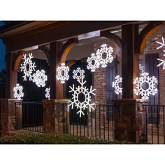 lighted snowflakes on the side of a building