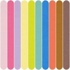 an assortment of different colored papers on a white background