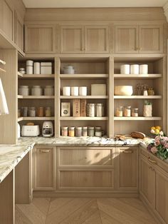 a kitchen filled with lots of wooden cupboards and counter top space next to a window