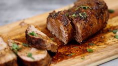 pork tenderloin on a cutting board with parsley