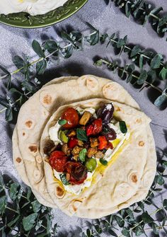 there is a pita with vegetables on it