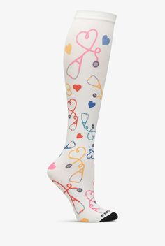 Treat your feet and legs to a little support. The light, gradient compression of Nurse Mates Stethoscope Hearts Women s Compression Socks is designed to help energize and soothe. Compression is greatest at the ankle, lessens gradually to the non-binding top band. Colorful, long-lasting print. One size fits most. • Nylon-stretch blend • Light compression: 12-14 mmHg • Gradient compression • Controlled pressure from the ankle up • Promotes better blood circulation • Reduces leg fatigue • Knee leng Nurse Essentials, Nurse Compression Socks, Nurse Socks, Light Gradient, Medical Shoes, Stethoscope Heart, Compression Stockings, Easy Stretches, New Nurse