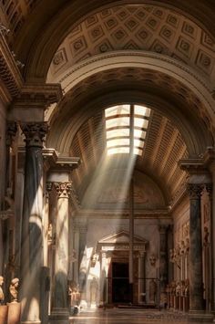 the sun shines through an arched window into a building with columns and pillars in it