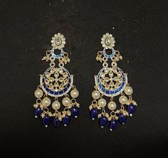 ROYAL BLUE CHANDBALI EARRINGS - WOMEN'S TRADITIONAL MEENAKARI JEWELRY Elegant set of earrings with beautiful blue Meenakari work. A versatile pair of earrings with royal blue & Gold Meenakari, Kundan and Pearl drop. The engraved traditional design adds an artisanal touch to the earrings. Details: Handcrafted Jewelry Metal: Metal Alloy, Gold Plated Stone:  Meenakari, Pearls &  Blue Gems Style: Contemporary yet Traditional Closure:  Push back clasp B Anu Designs jewelry pieces can be customized in Blue Temple Jewelry Earrings For Gift, Blue Temple Jewelry Earrings With Latkans, Blue Festive Jhumkas Drop Earrings, Blue Temple Jewelry Jhumkas Gift, Blue Temple Jewelry Style Drop Earrings, Blue Jhumkas Drop Earrings For Festive Occasions, Blue Temple Jewelry Dangle Earrings, Blue Temple Jewelry Earrings For Festive Occasions, Blue Dangle Temple Jewelry