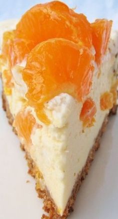 a slice of cheesecake with oranges on top