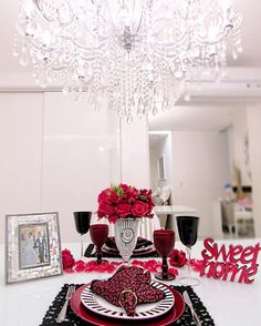 the table is set for valentine's day with red roses