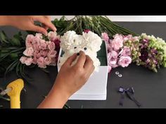 someone is making a teddy bear out of flowers