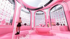 a woman standing in front of a pink bathroom with lots of mirrors and sinks on the walls