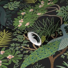 a green wallpaper with peacocks and flowers on it