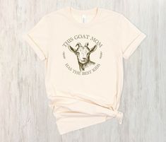 Cute Goat Mom Shirt is the Perfect Gift for Your Favorite Goat Lover. Great for Animal Lovers, Goat Farmers or Anyone. Comfortable Tee Comes in Several Colors and Pus Sizes This classic Bella + Canvas unisex jersey short sleeve tee fits like a well-loved favorite. Soft cotton and quality print make users fall in love with it over and over again. These t-shirts have-ribbed knit collars to bolster shaping. The shoulders are tapered for a better fit over time. Dual side seams hold the garment's sha Cute Goat, Farm Tees, Goat Shirts, Goat Farm, Goat Lover, Cute Goats, Goat Farming, Animal Tshirt, Mom Shirt