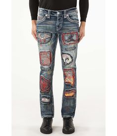 From Rock Revival&#x2C; these jeans feature:Alternate straight-leg fitBelt loopsZip/button-front closureTwo back flap pockets with winged fleur-de-lis designEmbellished artwork patch detail throughoutFaux-leather belt loop patch32" inseam5-pocket stylingCotton/elastane denimMachine wash/tumble dryImported. Mens Straight Jeans, Rock Revival, Flap Pocket, Straight Leg Jeans, Mens Jeans, Straight Leg, Clothes