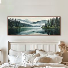 a bed with white sheets and pillows in front of a painting on the wall above it