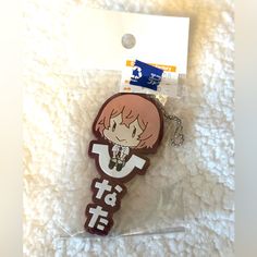 a key chain with an anime character on it