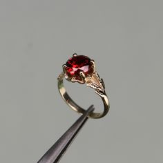 Garnet Gold Plated 925 Silver Ring, Red Stone Ring, Unique Engagement Rings, Propose Ring For Women, Dainty Branch And Leaves -->Ring details: - Theme: Daily, Minimalist, Romantic Wedding & Engagement - Comfortable band - Center Stone : Garnet - Garnet Carat: 8mm --->Materials:   - 925 Silver Gold Plated --->The ring size on the model is 6 US. --->Items are shown larger in pictures to show detail - please note the dimensions. This item is in my shop are handcrafted made to order. --->Accessories Heirloom Red Birthstone Ring, Red Round Band Promise Jewelry, Heirloom Style Red Sapphire Round Ring, Red Ruby Ring For Promise With Round Band, Red Promise Ring With Round Band, Heirloom Style Red Birthstone Ring For Gift, Heirloom Red Birthstone Promise Ring, Heirloom Red Round Cut Ring, Heirloom Red Promise Ring