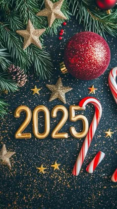 christmas decorations and candy canes on a black background with the year 2055 written in gold