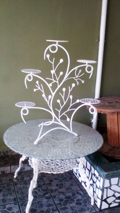 a white table sitting on top of a tiled floor