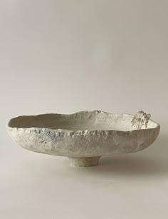 a white bowl sitting on top of a table