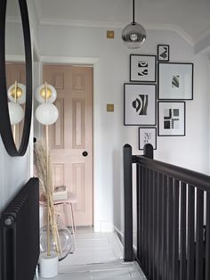 the hallway is clean and ready to be used as a home decor area for someone's family