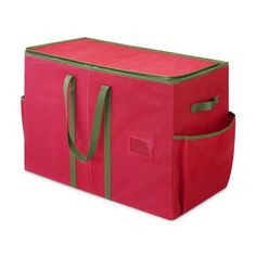 a red storage bag with green trimmings on the bottom and sides, sitting upright