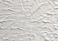 a white wall that has some paint on it