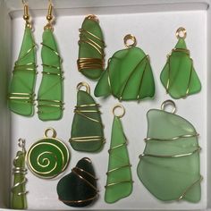 a box filled with lots of green glass pieces and wire wrapped around the items in it