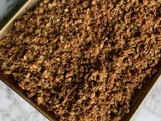 a pan filled with granola sitting on top of a counter