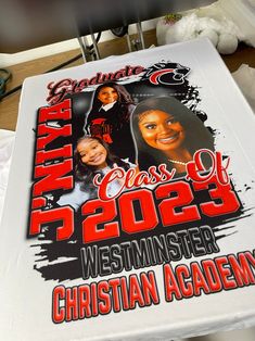 a large white sign with two women's heads on it and the words, class of 2055 westminster christian academy